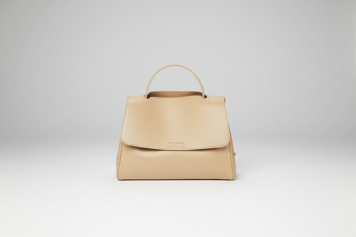 Beige handbag on a white background