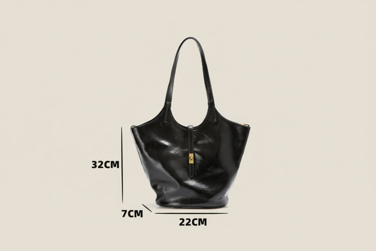 Black handbag with measurements and product details on a beige background