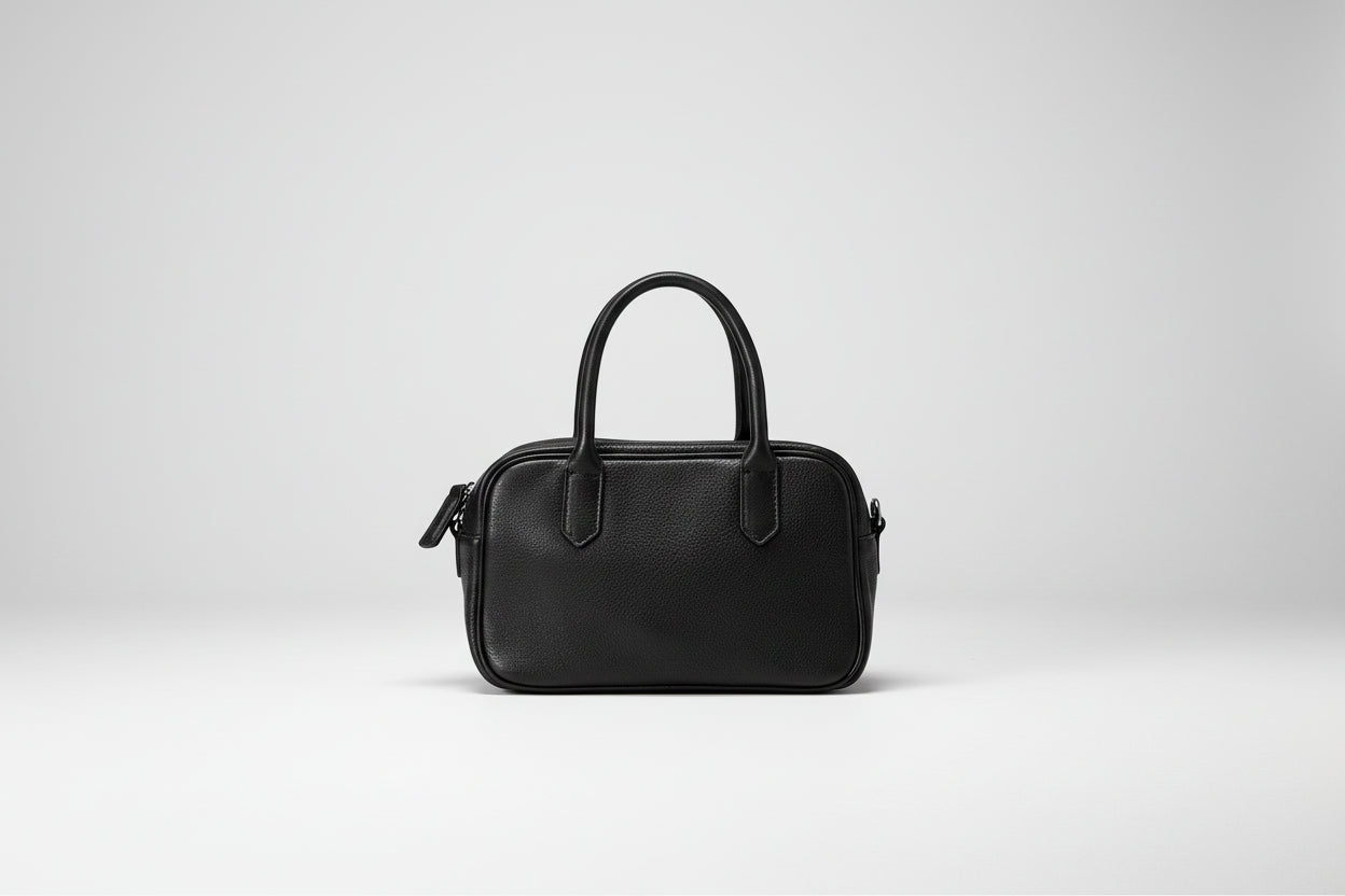 Black handbag on a white background
