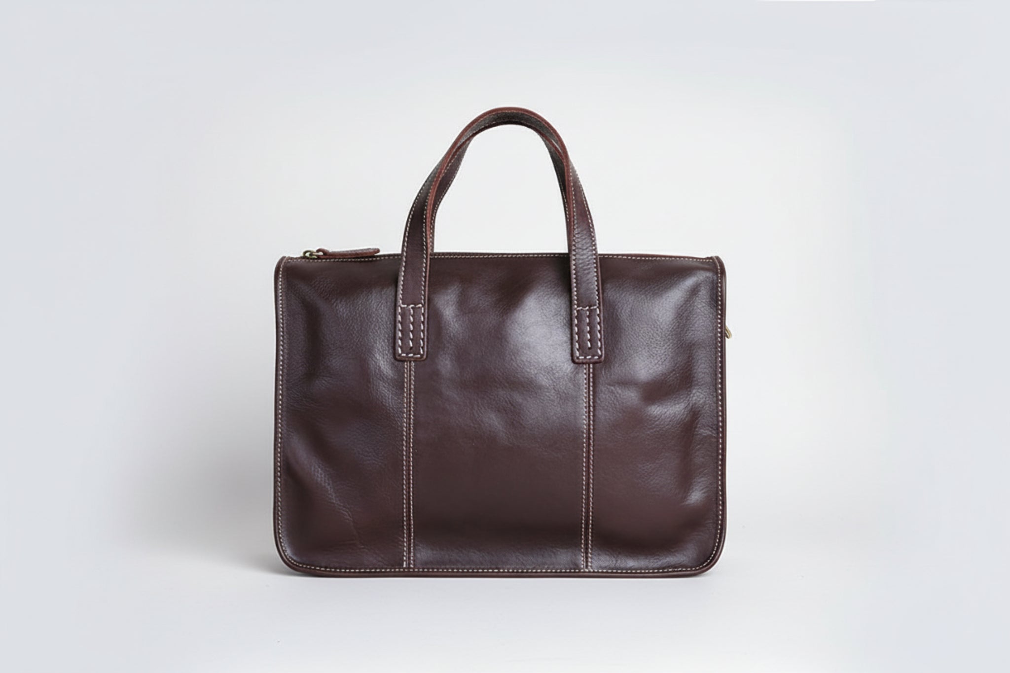 Brown leather briefcase on a white background