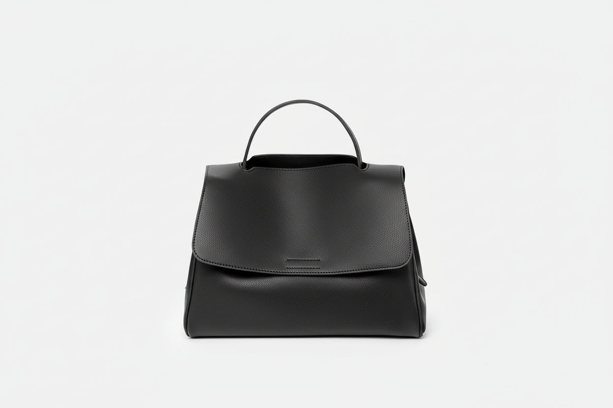 Black leather backpack on a white background