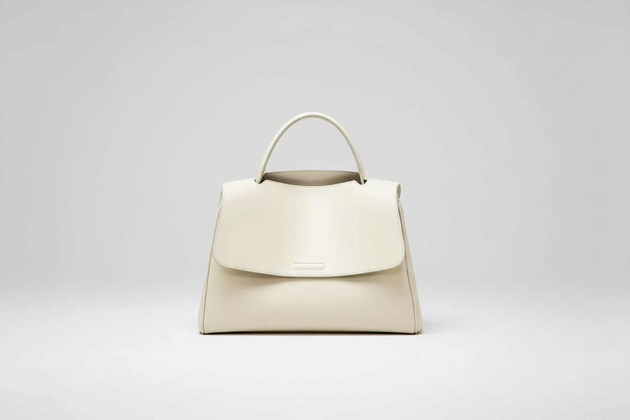 Beige handbag on a white background