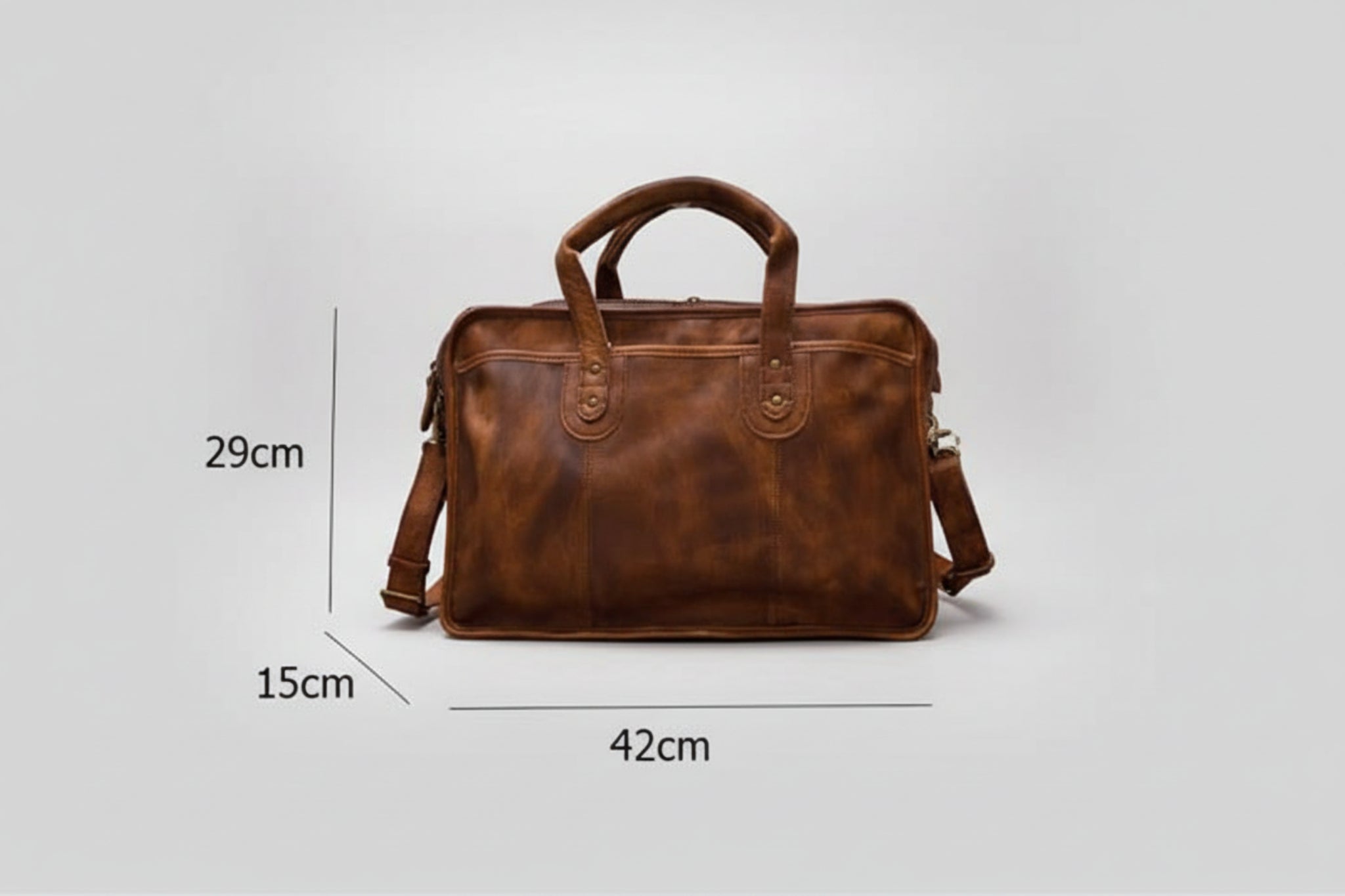 Brown leather bag with measurements on a beige background