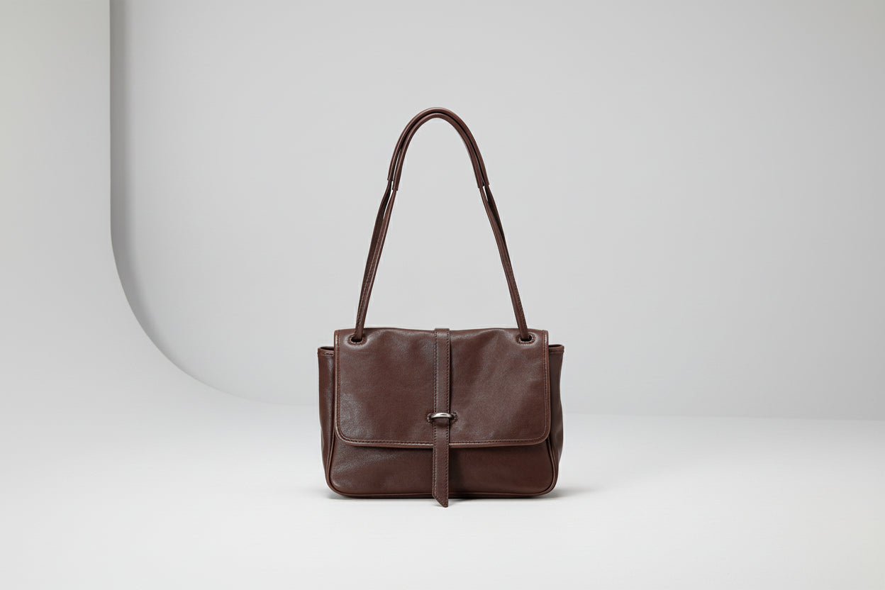 Brown leather handbag on a white background